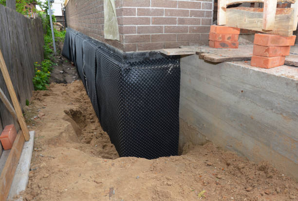 Happy homeowners after waterproofing job in Java Center